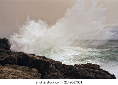 Waves Crashing On The Coast During A Storm With Saharan Dust In The Air                               