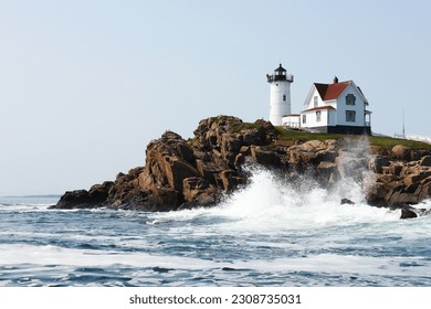Waves crashing on Ogunquit lighthouse