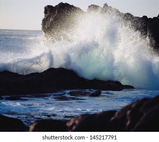 waves crashing on rocks