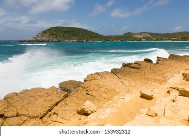 Waves Crashing On Rocky Limestone Coastline At Half Moon Bay Antigua