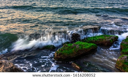 Waves crashing on the rocky seashore