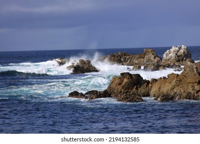 
Waves Crashing Onto Rocks In Monterey Bay, CA