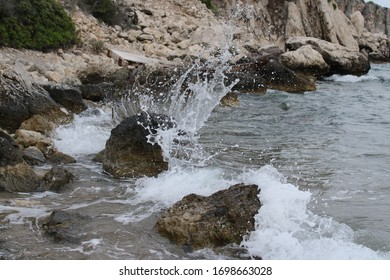 The waves hit a stone