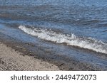 Waves hitting the boat ramp at Truman Lake, Warsaw, MO, Missouri, US, United States. Harry S Truman Reservoir is a popular summertime vacation spot for fishing, boating, and other water activities.
