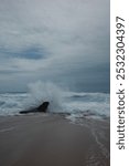 Waves hitting a rock at Baishawan Beach, Pingtung, Taiwan. 