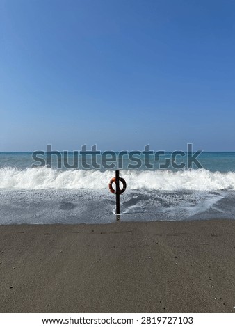 Waves invading the beach after a storm in Liguria
