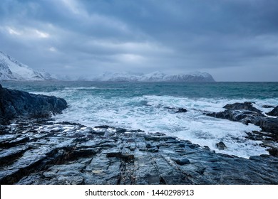 Waves of Norwegian sea crushing at rocky coast in fjord. Vikten, Lofoten islands, Norway - Powered by Shutterstock