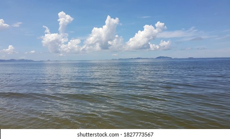 The Waves On The Sea Saw Blue Sky And Clouds.