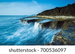 Waves over rock
