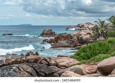 Waves and rocks at Anse Songe, La Digue, The Seychelles. While hiking on The Seychelles we arrived at Anse Songe. Typical granite rocks. The Seychelles is much more than only sand beaches. - Powered by Shutterstock