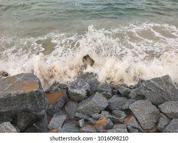 Waves Splash Over Rocks On The Beach