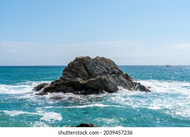 waves splashes on rock in sea shore, pretty calm sea