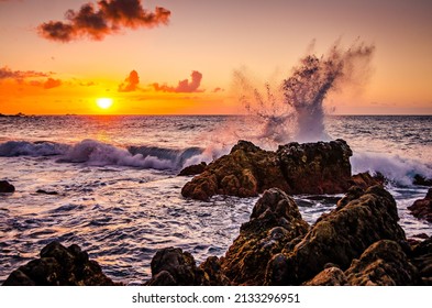 Waves splashing on rocks in the sunset. Sunset over the ocean with breaking waves. Rocks in the sea. Beautiful landscape of Tenerife with sunset. Playa de las arenas beach, Canary Islands Spain - Powered by Shutterstock