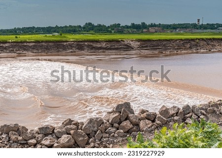 Waves from tidal bore waters as river is reversed in Moncton New Brunswick Canada