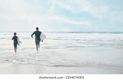 Waves wait on no one. Shot of a man and his young son at the beach with their surfboards. - Powered by Shutterstock