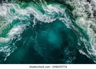 Waves of water of the river and the sea meet each other during high tide and low tide. Whirlpools of the maelstrom of Saltstraumen, Nordland, Norway - Shutterstock ID 1940195776