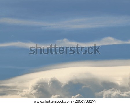 Wave-Shaped Cirrus Clouds Above a Flat Pileus Cloud Layer