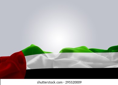 Waving Abstract Fabric UAE Flag On Gray Background