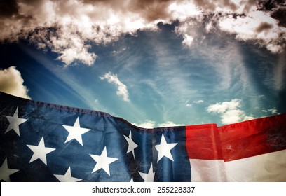 Waving American Flag And Sky In Dark Grunge Style