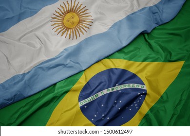 Waving Colorful Flag Of Brazil And National Flag Of Argentina. Macro