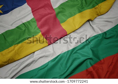 waving colorful flag of bulgaria and national flag of central african republic. macro