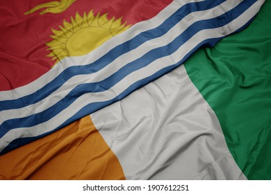 waving colorful flag of cote divoire and national flag of Kiribati . macro