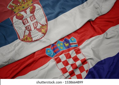 Waving Colorful Flag Of Croatia And National Flag Of Serbia. Macro