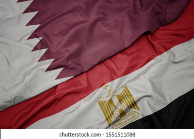 Waving Colorful Flag Of Egypt And National Flag Of Qatar. Macro