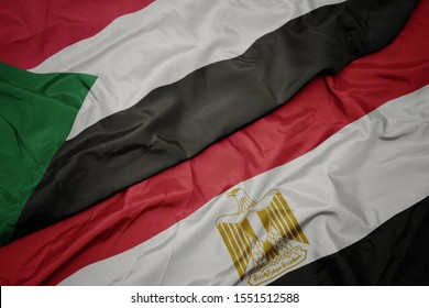 Waving Colorful Flag Of Egypt And National Flag Of Sudan. Macro