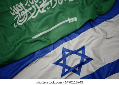 Waving Colorful Flag Of Israel And National Flag Of Saudi Arabia. Macro