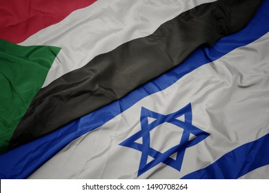 Waving Colorful Flag Of Israel And National Flag Of Sudan. Macro