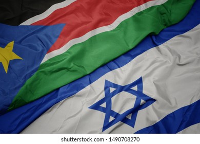 Waving Colorful Flag Of Israel And National Flag Of South Sudan. Macro