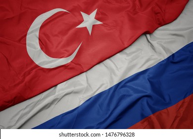 Waving Colorful Flag Of Russia And National Flag Of Turkey. Macro