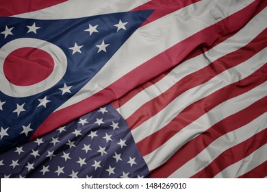 waving colorful flag of united states of america and flag of ohio state. macro
