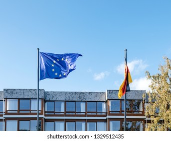 Waving European Union Blue Flag And German Flags In Front Of Federal Constitutional Court Building Bundesverfassungsgericht The Supreme Court For The Federal Republic Of Germany