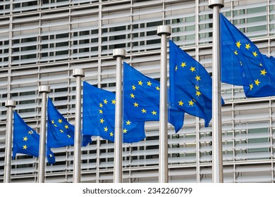 Waving European Union flags in a row in Brussels, Belgium. Close up