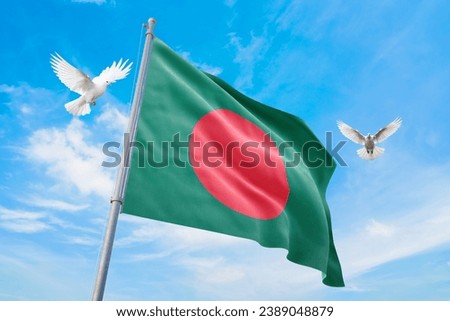Waving flag of Bangladesh in beautiful sky and flying pigeons. Bangladesh flag for independence day. The symbol of the state on wavy fabric.