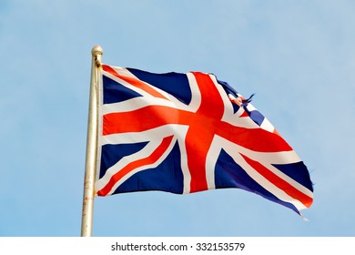 waving flag in the blue sky british colour and wave - Powered by Shutterstock