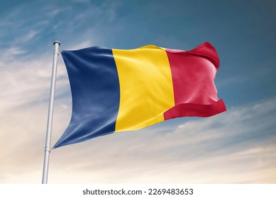Waving flag of Chad in beautiful sky. Chad flag for independence day. The symbol of the state on wavy fabric.
