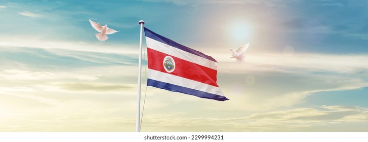 Waving flag of Costa Rica in beautiful sky. Costa Rica flag for independence day. - Shutterstock ID 2299994231