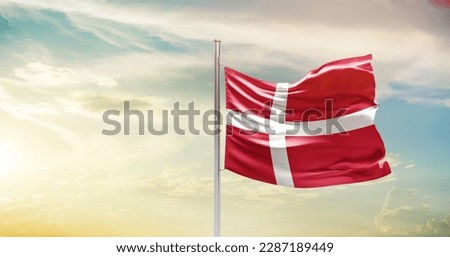 Waving flag of Denmark in beautiful sky. Denmark flag for independence day.
