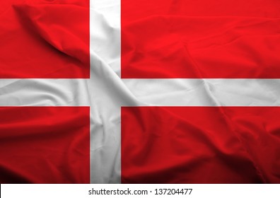 Waving flag of Denmark. Flag has real fabric texture.