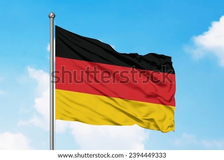 Similar – Waving German flag in front of a blue sky with clouds, Hallig Oland in the background