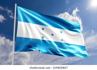 Waving Flag Of Honduras With Sun And Cloudy Sky In The Background