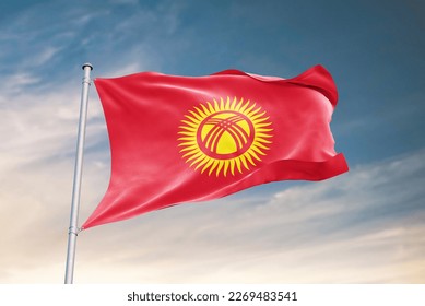 Waving flag of Kyrgyzstan in beautiful sky. Kyrgyzstan flag for independence day. The symbol of the state on wavy fabric.