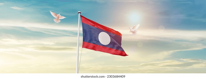 Waving flag of Laos in beautiful sky. Laos flag for independence day. - Powered by Shutterstock