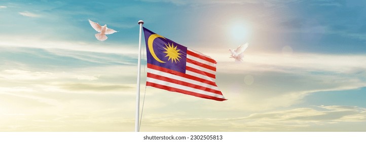 Waving flag of Malaysia in beautiful sky. Malaysia flag for independence day.