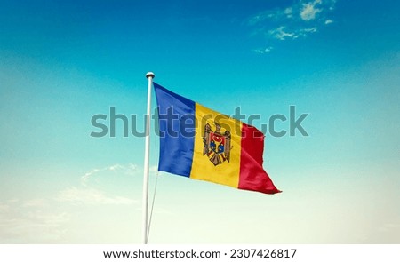 Waving flag of Moldova in beautiful sky. Moldova flag for independence day.