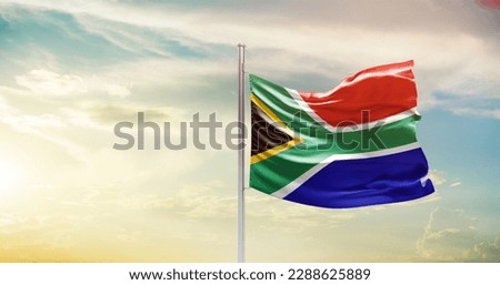 Waving flag of South Africa in beautiful sky. South Africa flag for independence day.