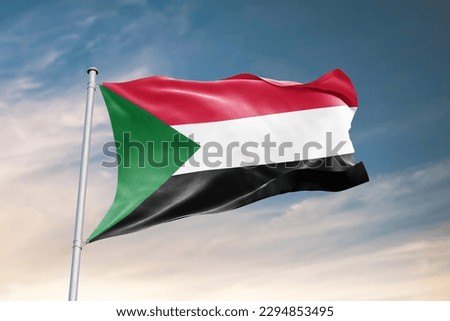 Waving flag of Sudan in beautiful sky. Sudan flag for independence day. The symbol of the state on wavy fabric.